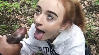 Petite redhead teenager, tattooed and petite, enjoys an interracial deepthroat session outside in public with small tits